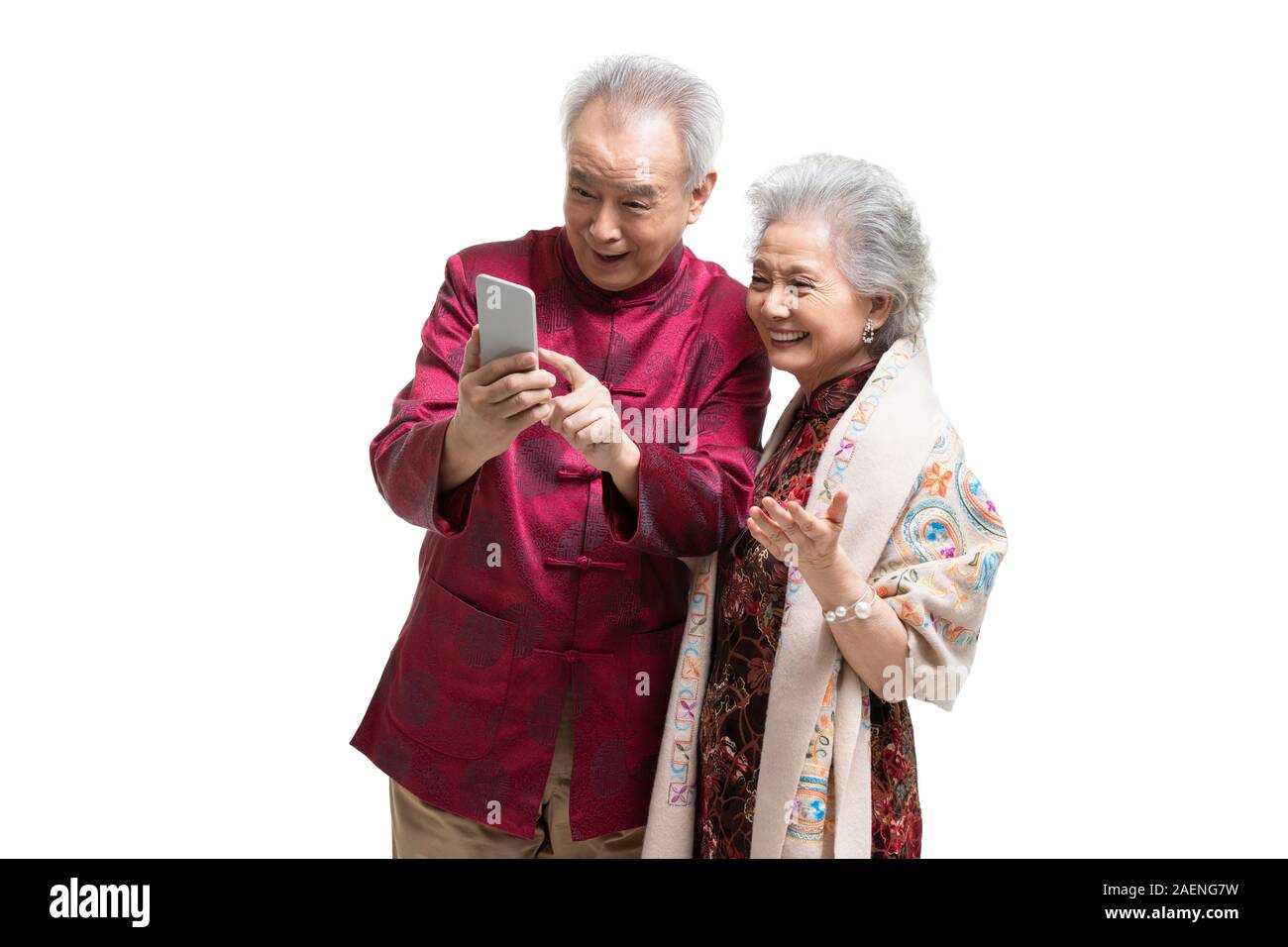 Happy senior couple using smartphone Stock Photo