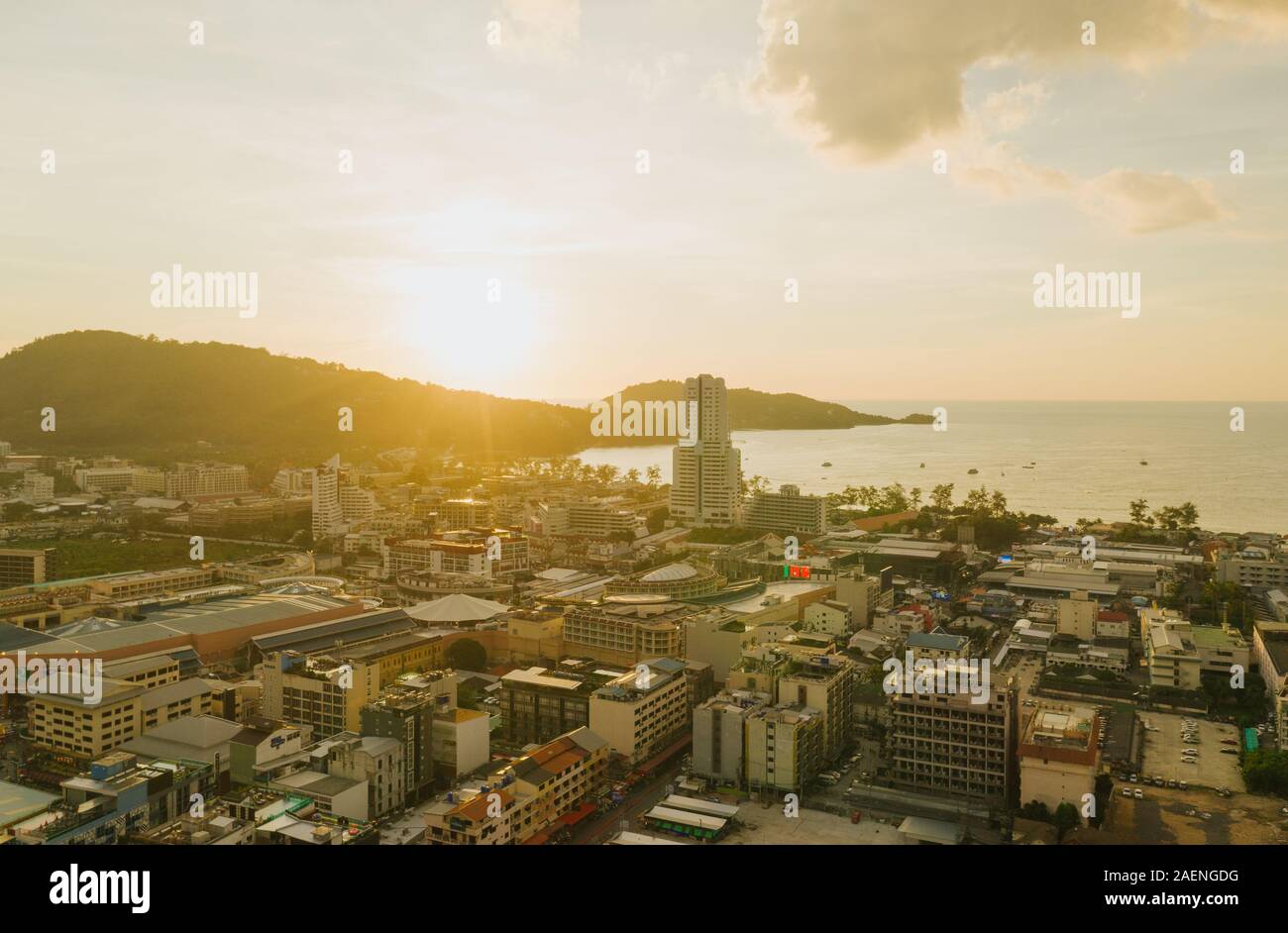 Sunset on Patong Beach and city life in Thailand Phuket Island Drone flight Stock Photo