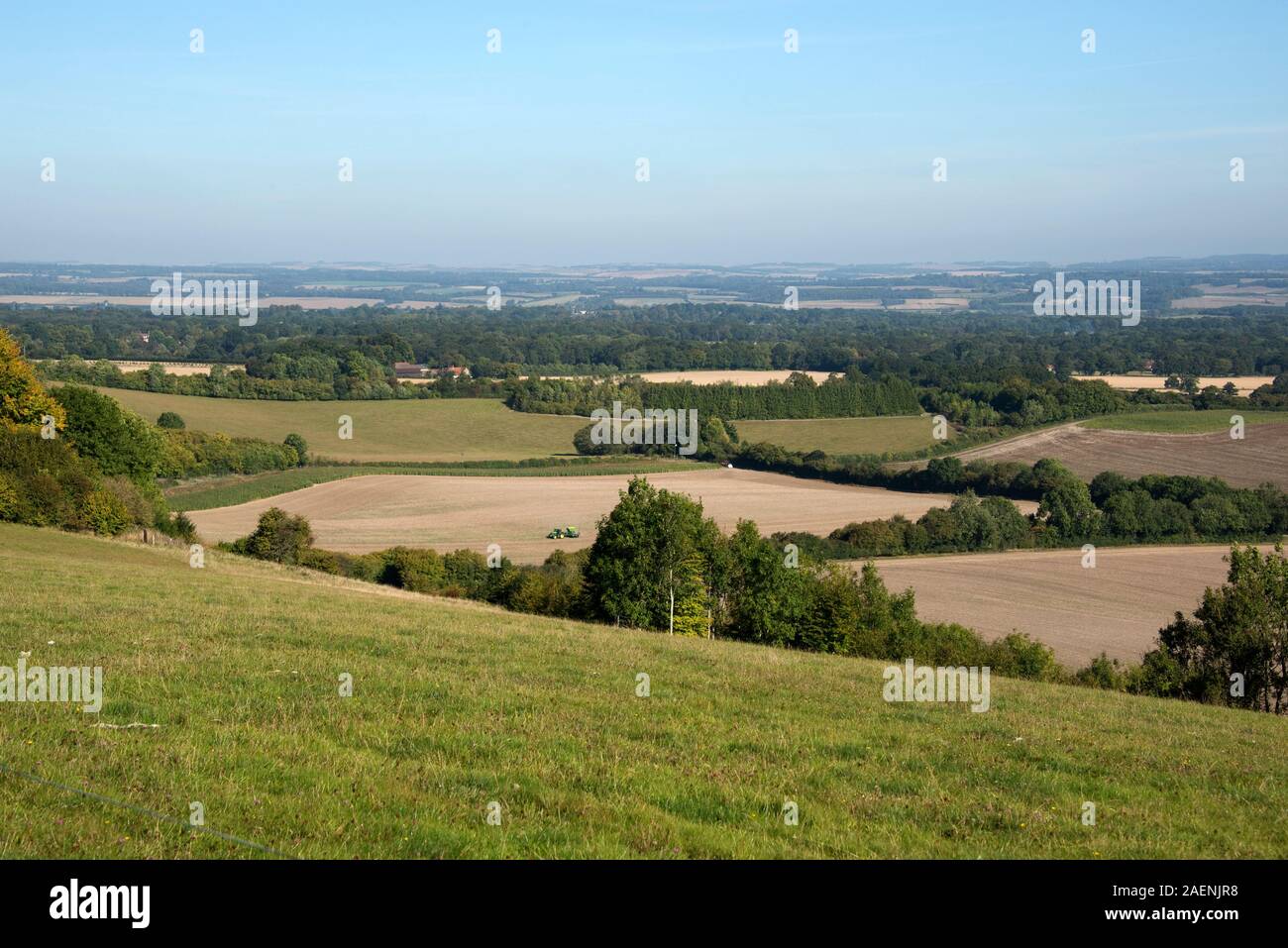 West Berkshire farmland, woodland, fallow fields, pastureland, stubble  and tractor working on a fine autumn day from the North Wessex Downs, Septembe Stock Photo