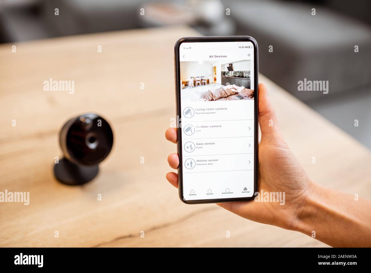 Close-up on a smart phone with launched security application and IP camera  at the table. Home video surveillance concept Stock Photo - Alamy