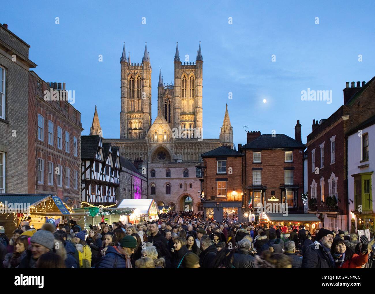 Lincoln Cathedral pictured with new floodlighting installed during 2019. The picture was taken during the annual Christmas market before Christmas. Stock Photo