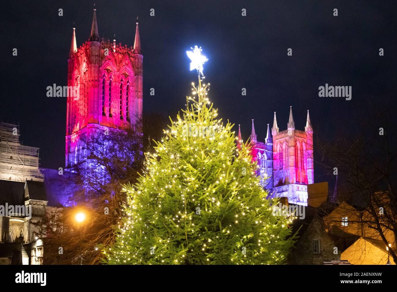 Lincoln Cathedral floodlit using coloured light introduced in 2019. Picture taken from the back of the Cathedral. Stock Photo