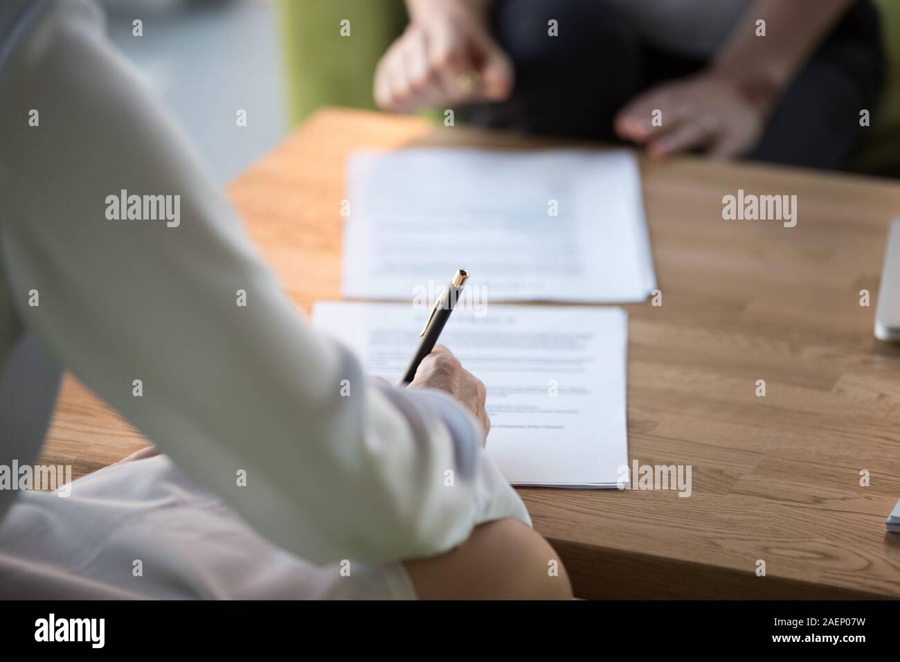 Close up businesswoman signing job contract or partnership agreement Stock Photo