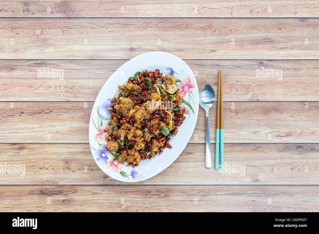 Authentic Sichuan Szechuan fried chicken with spicy red hot chillies