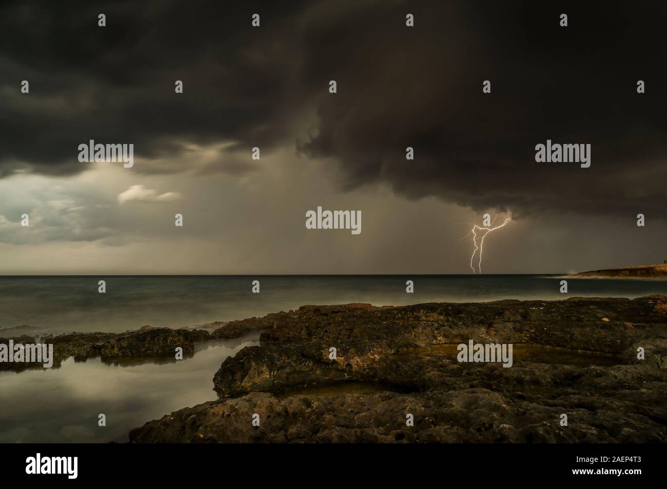 Thunderstorm and black clouds on island Stock Photo
