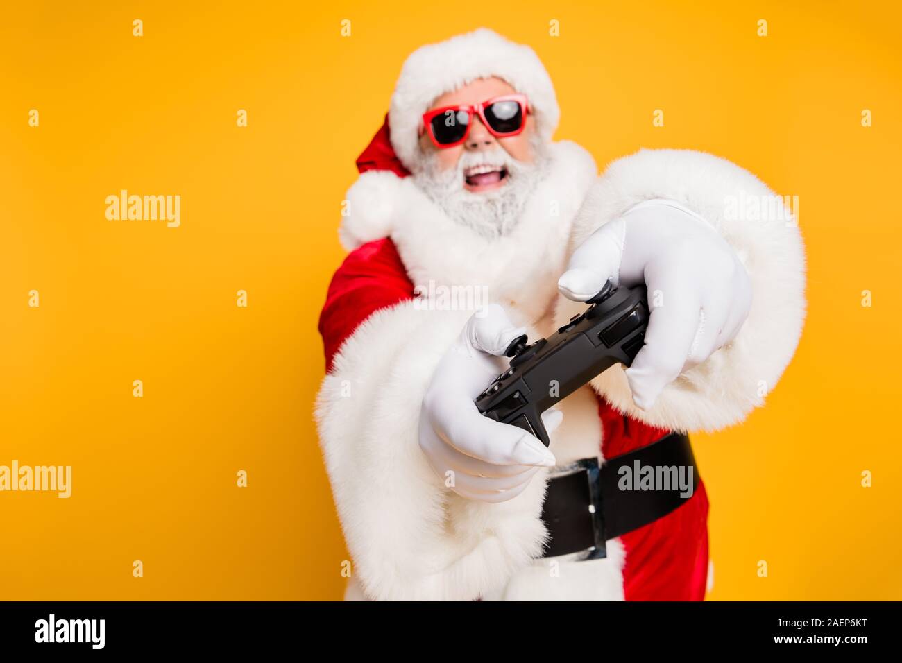 I will win. Portrait of funky funny crazy hipster santa claus play  videogame use joystick having holly x-mas jolly newyear celebration  isolated over Stock Photo - Alamy