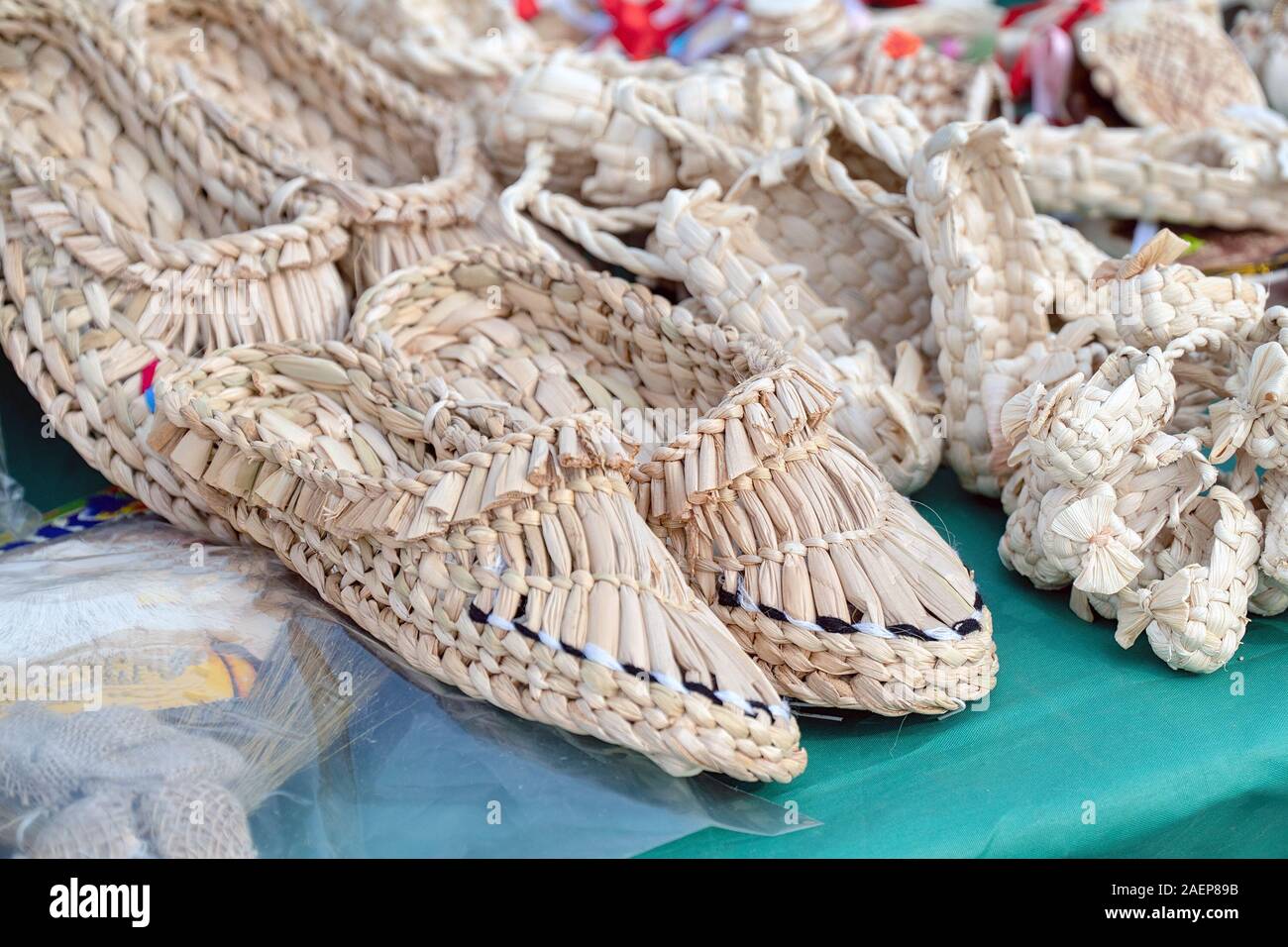 Souvenir bast shoes woven from bast. Old traditional Russian shoes Stock Photo Alamy