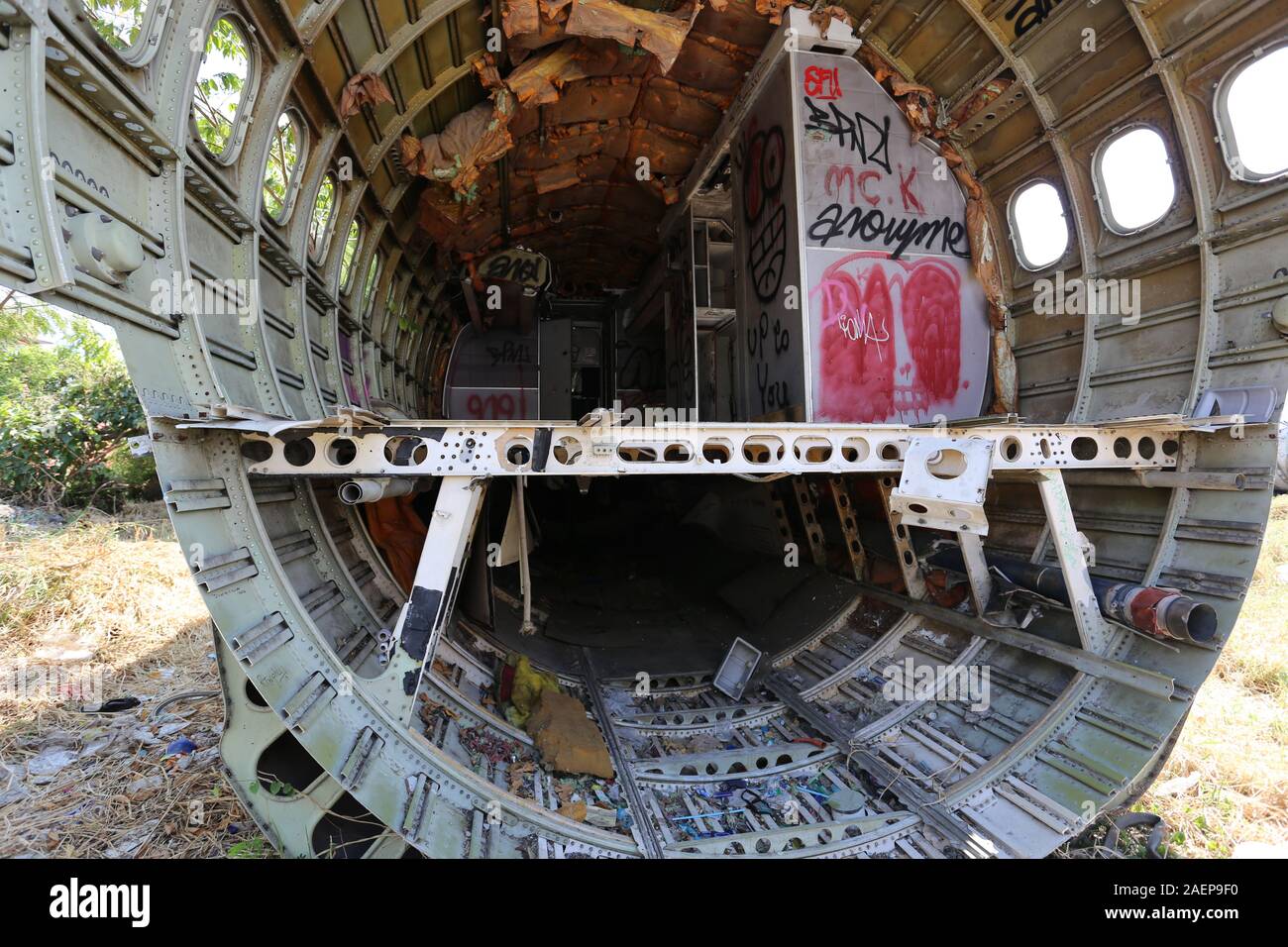 Bangkok's Airplane Graveyard hosts a handful of fuselages and airplane parts that have been partly covered by graffitti Stock Photo