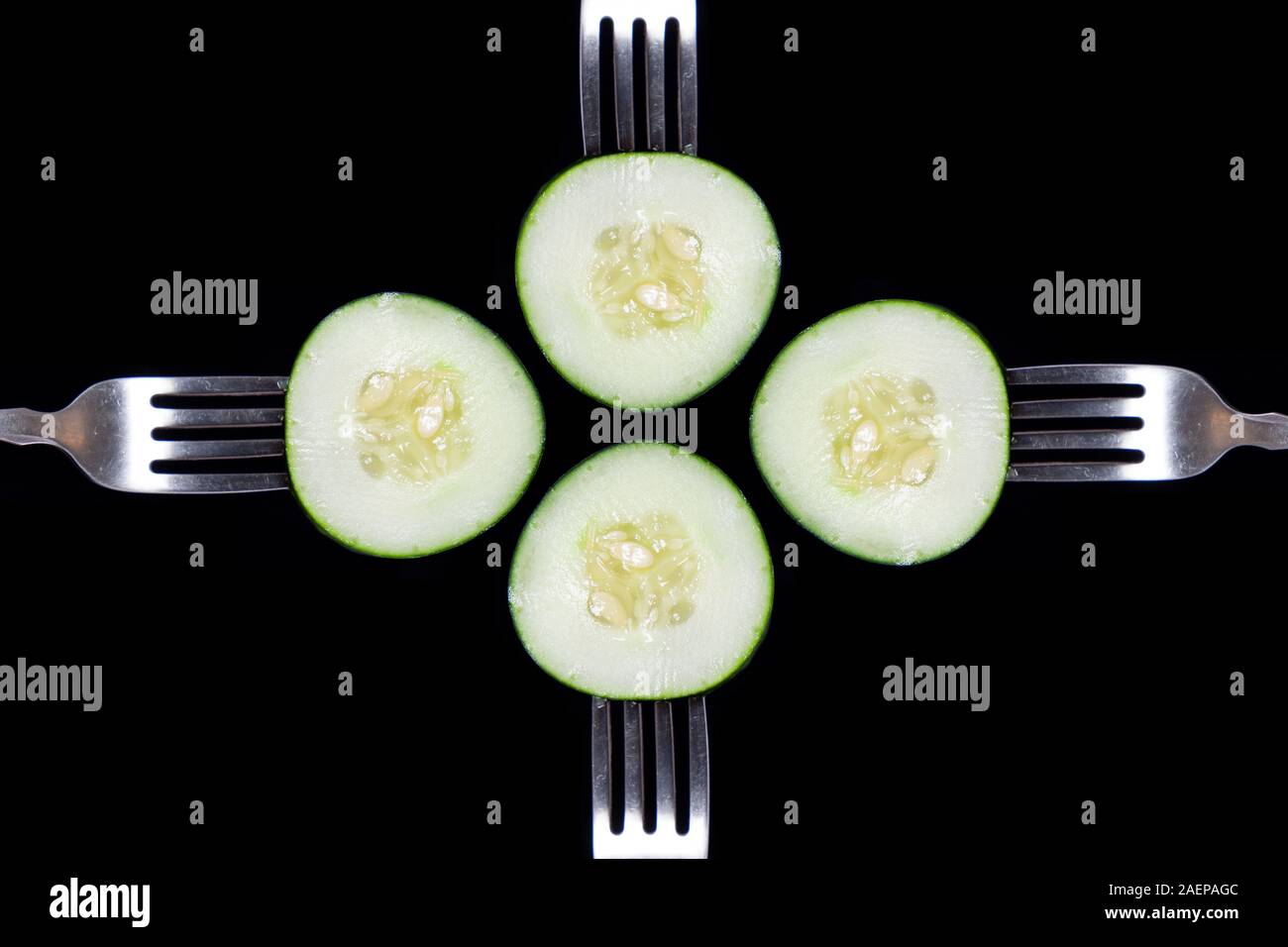 Cucumbers on forks.  Eat up and get all your nutrients! Stock Photo