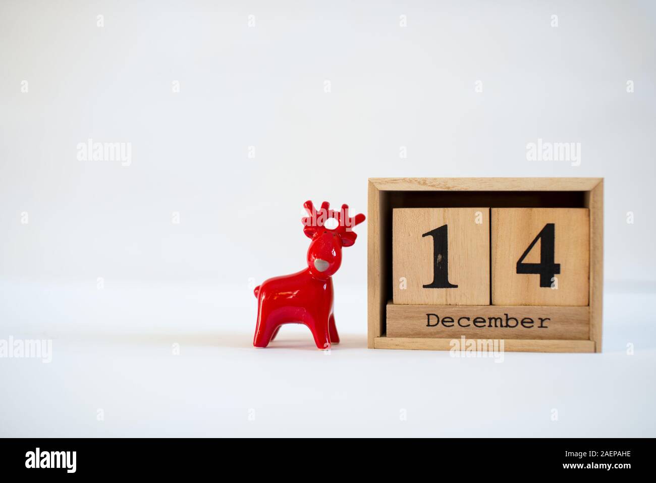 Cube wooden calendar showing date on 14th December with ceramic ...