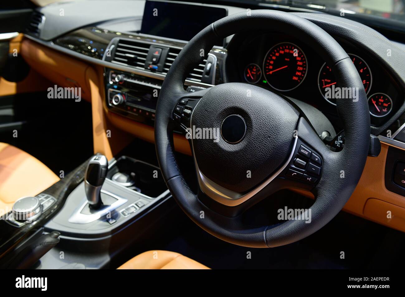 Car interior luxury steering wheel and dashboard Stock Photo