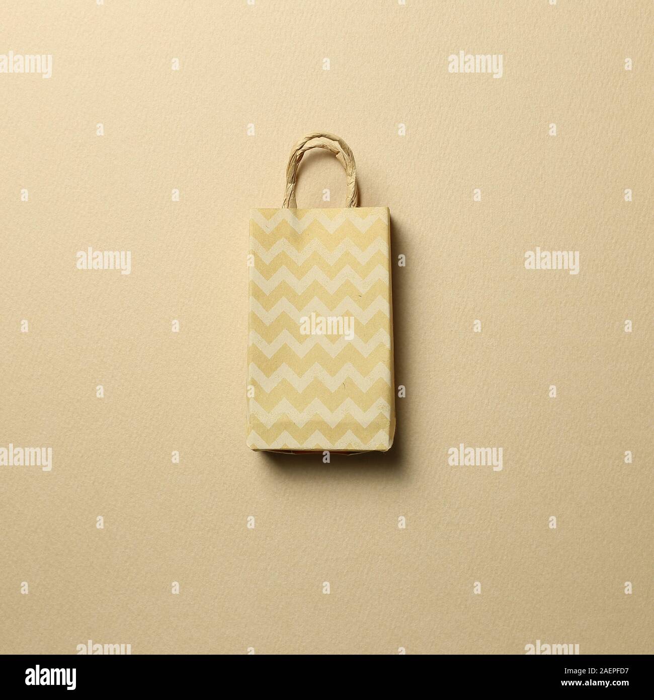 Paper shopping bag on brown background Stock Photo