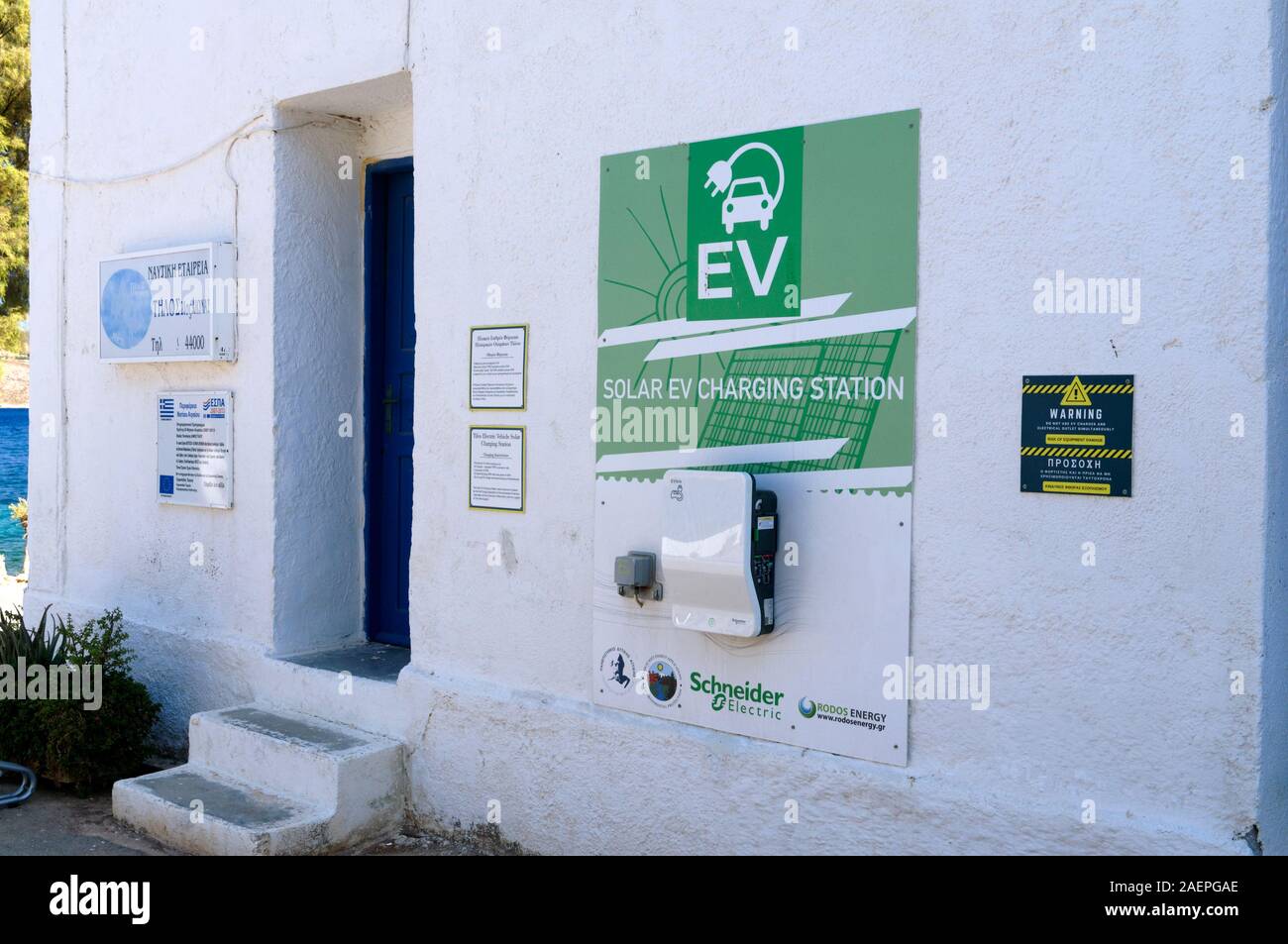 Solar powered electric car charging station, Livadia, part of the Just Go Zero Tilos initiative, Tilos, Dodecanese islands, Southern Aegean, Greece. Stock Photo