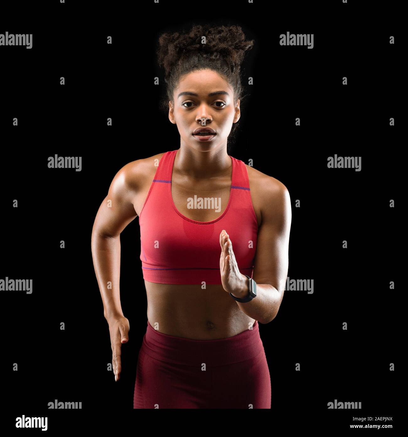 Strong athletic afro woman running over black background Stock Photo - Alamy