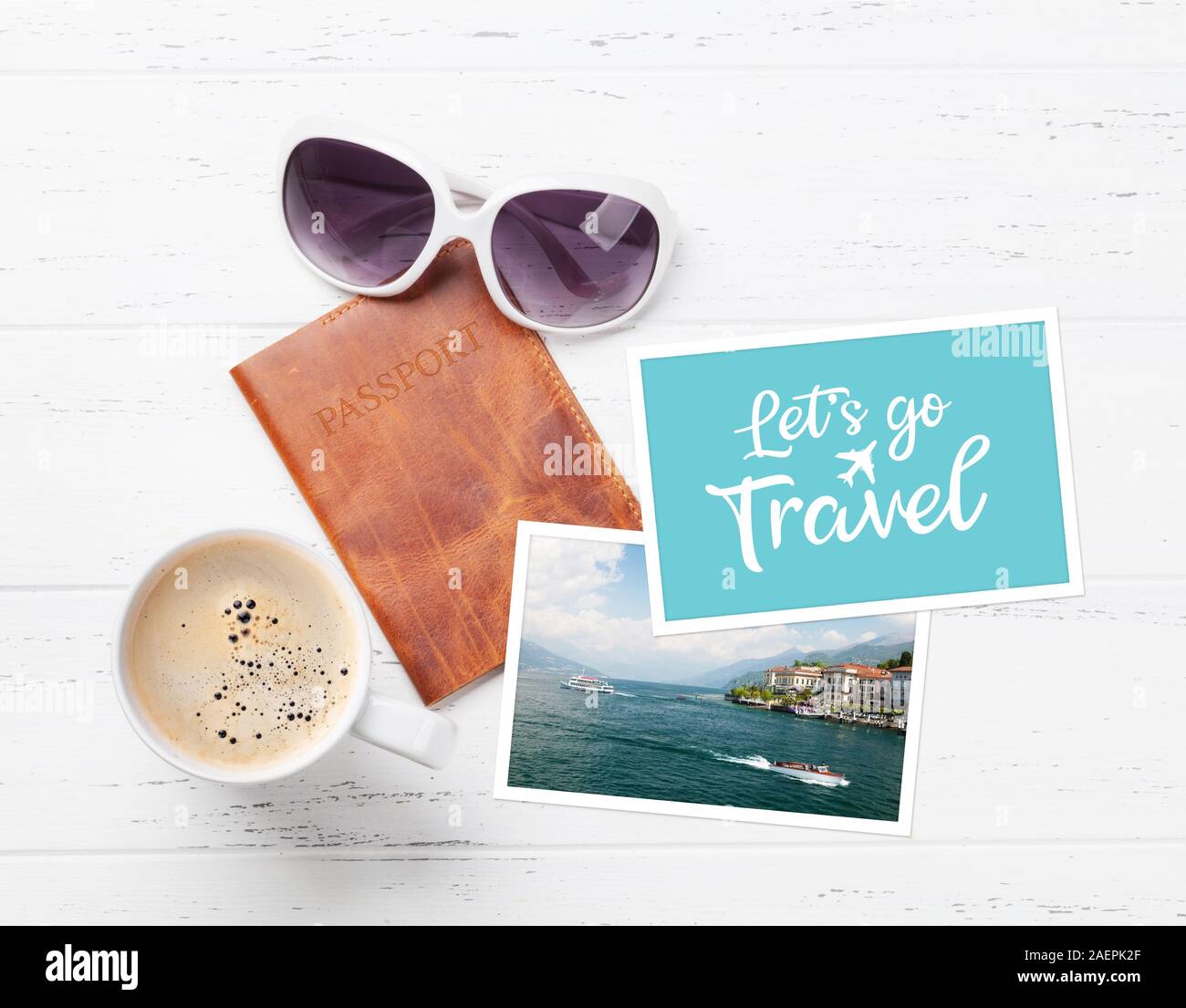 Travel vacation concept with passport, coffee cup, photos and sunglasses on wooden backdrop. Top view with copy space. Flat lay Stock Photo