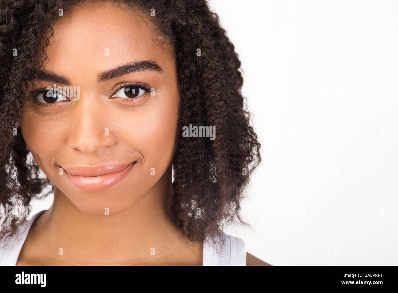 Close up portrait of beautiful smiling black girl Stock Photo