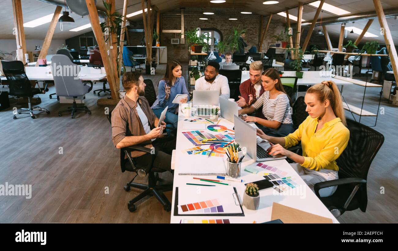 Coworking process. Designers working with project in office Stock Photo