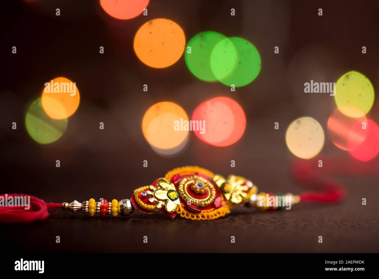 Raksha Bandhan background with an elegant Rakhi. A traditional Indian ...