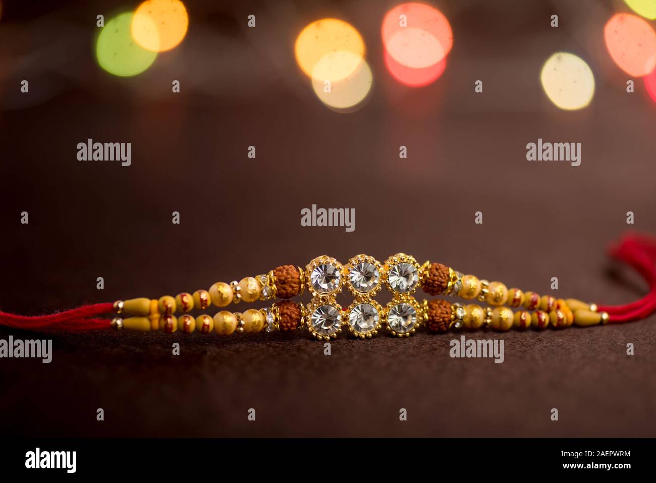 Raksha Bandhan background with an elegant Rakhi. A traditional Indian ...