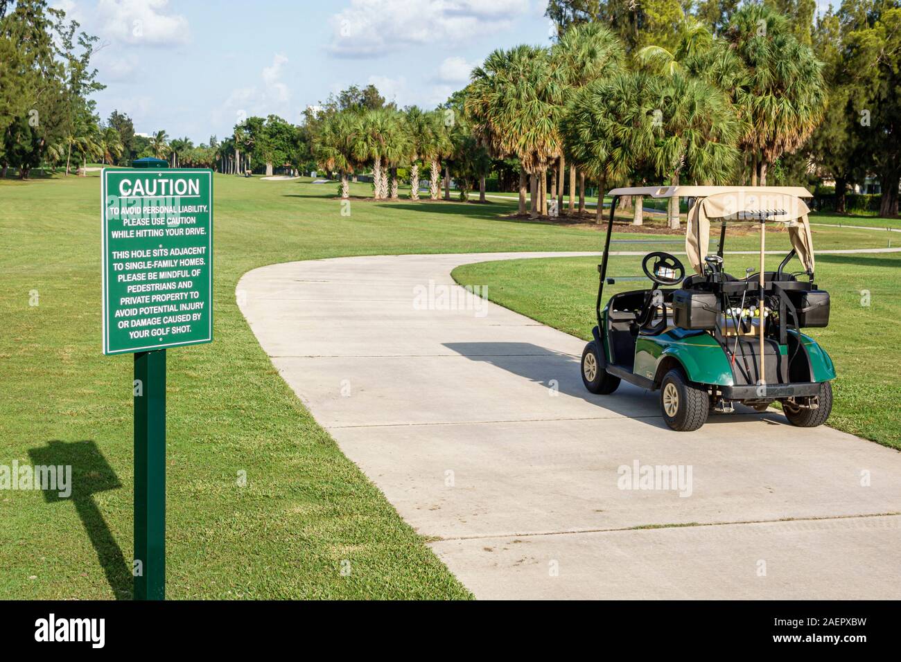 Miami Beach Florida,Normandy Isle Golf Club course,fairway,cart,sign,caution sign,FL190920179 Stock Photo