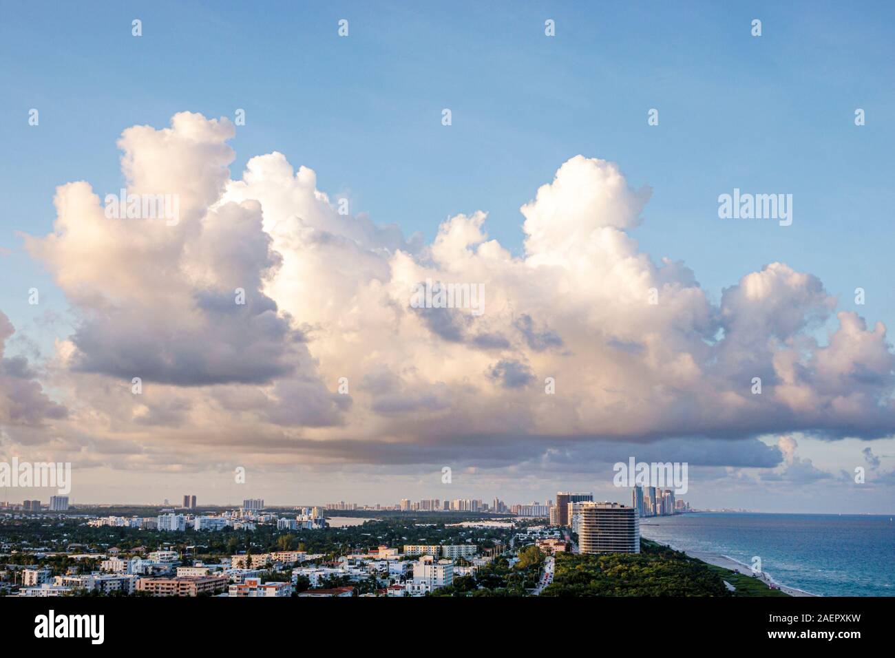 Miami Beach Florida,North Beach,city skyline,shore,clouds,weather water,Atlantic Ocean,aerial overhead view from above,FL191025019 Stock Photo