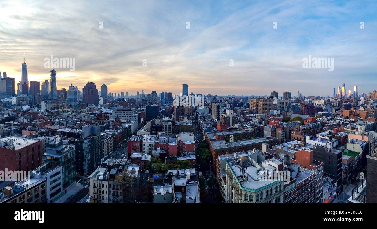 Panoramic New York City skyline view as dusk falls on the buildings of Manhattan NYC Stock Photo