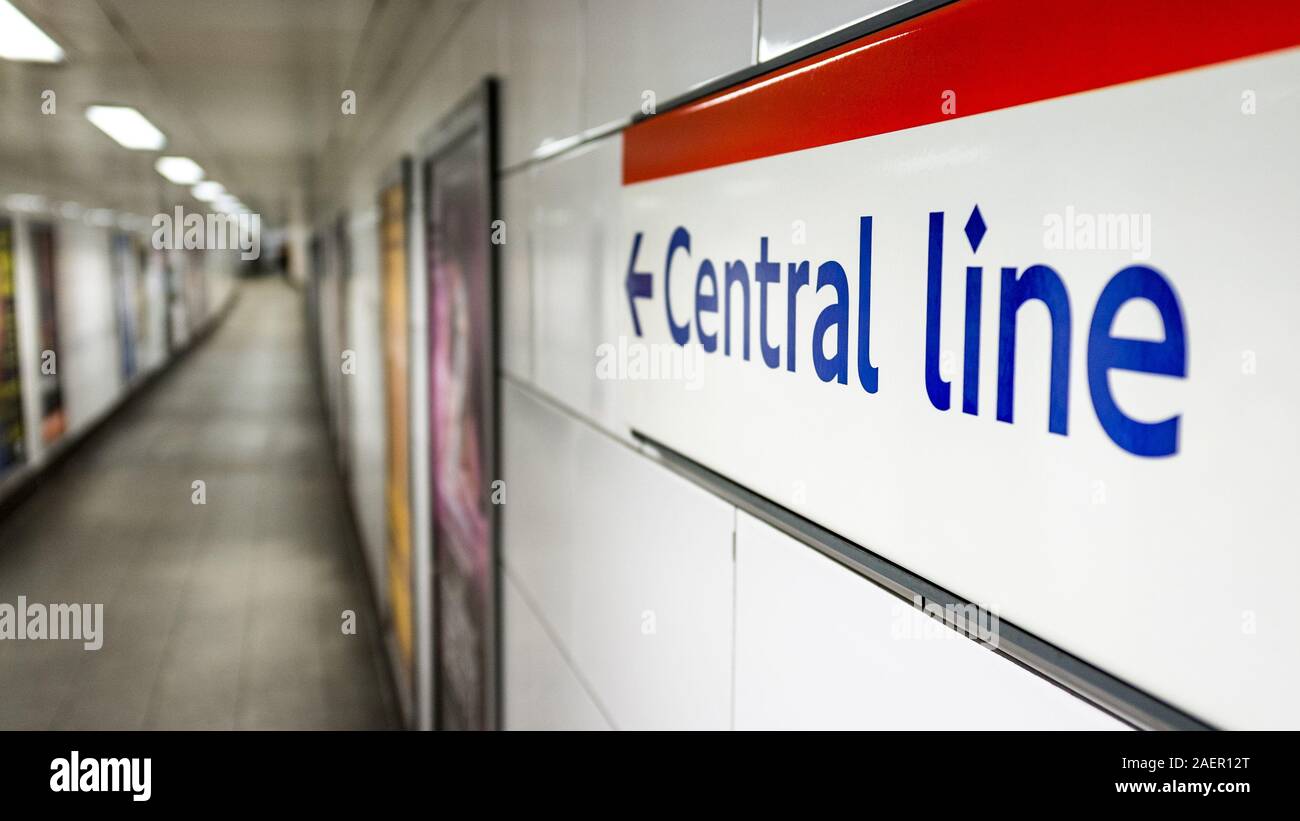 Central Line sign. Direction sign on the wall of a London Underground station pointing travellers in the direction of the red Central Line. Stock Photo