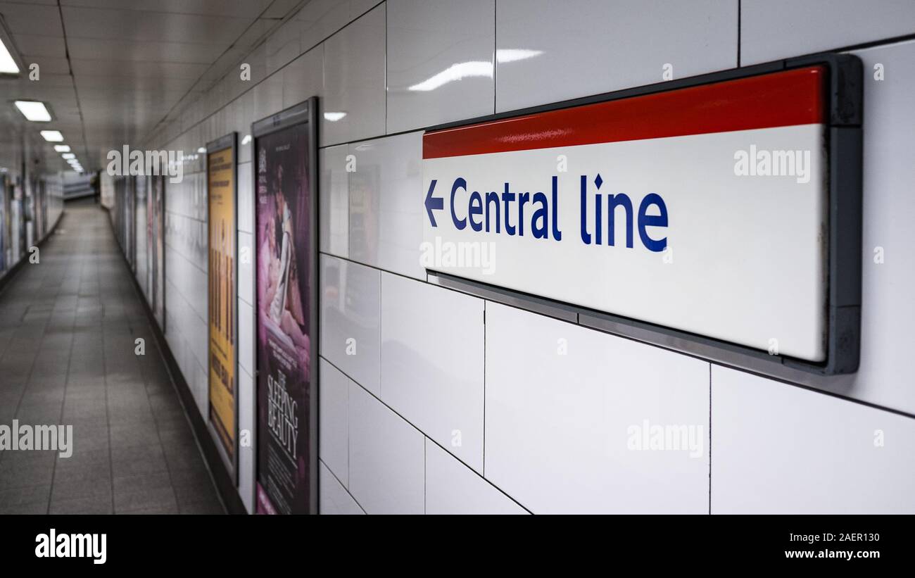 Central Line sign. Direction sign on the wall of a London Underground station pointing travellers in the direction of the red Central Line. Stock Photo