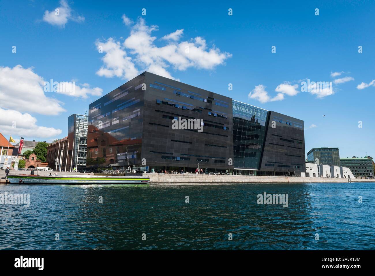 Black Diamond Copenhagen, waterfront view of the Den Sorte Diamant building, a modern extension to the Royal Danish Library in Slotsholmen, Copenhagen Stock Photo