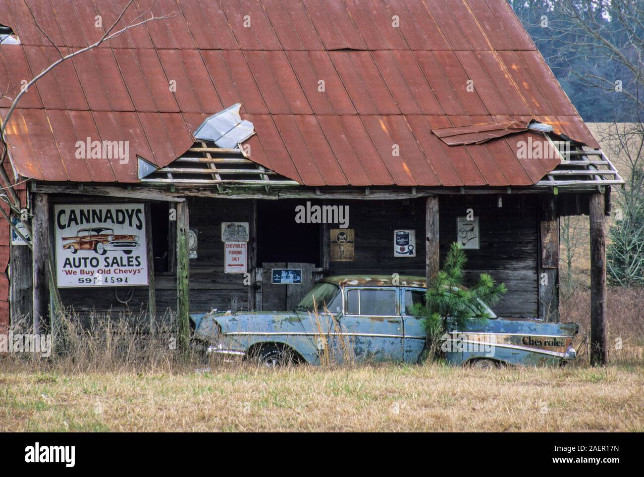 Vintage Chevrolet, Chevy sales dealer, with an antique Chevy in front