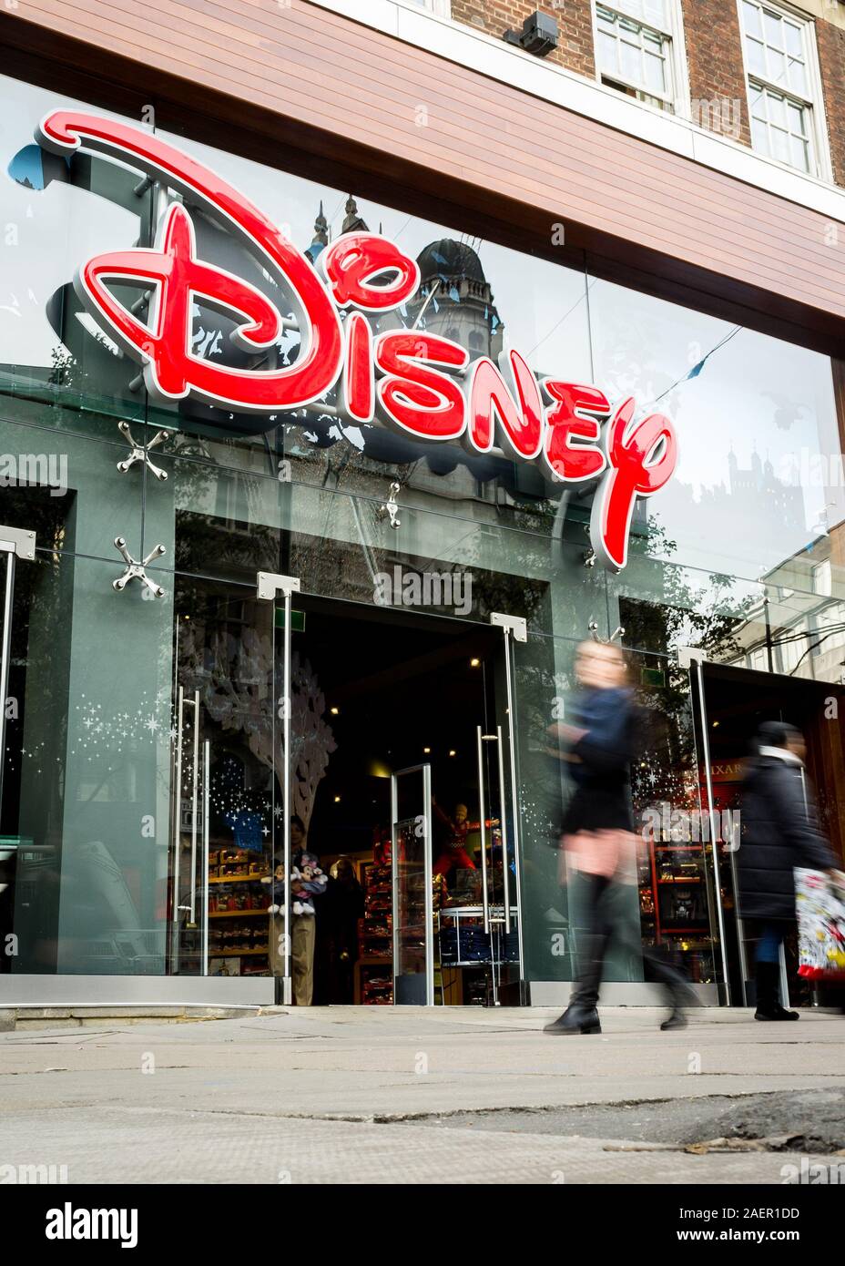 Disney Store, Oxford Street, London. Anonymous shoppers walking past the Disney store in the heart of London's shopping district. Stock Photo