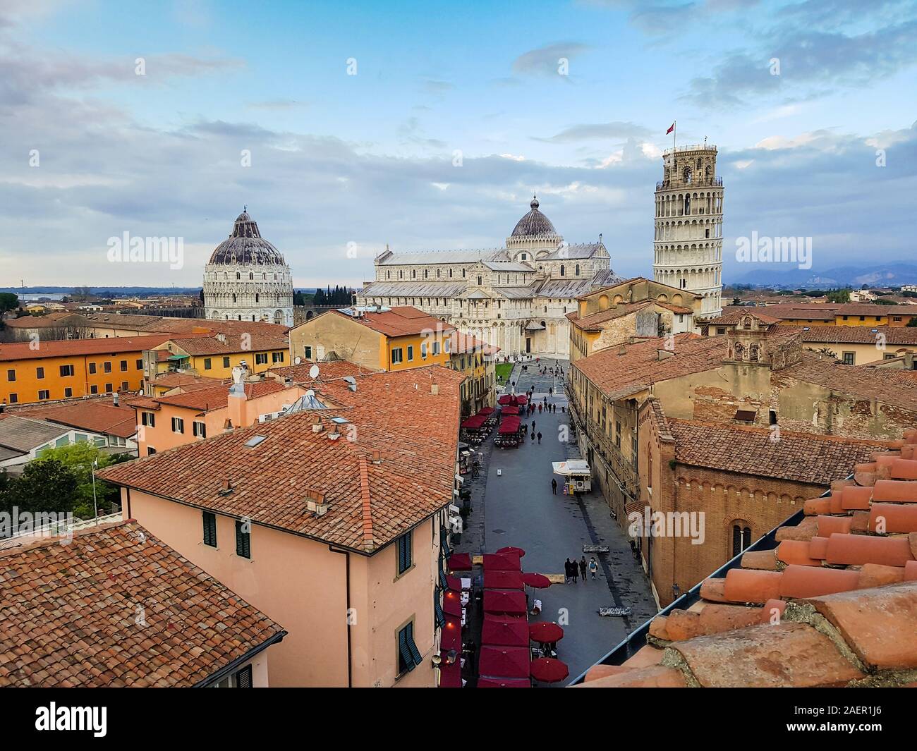 Panoramic view of Pisa, Italy. The leaning Tower, the Cathedral and the Baptistery seen from the roofs of the city center. Stock Photo