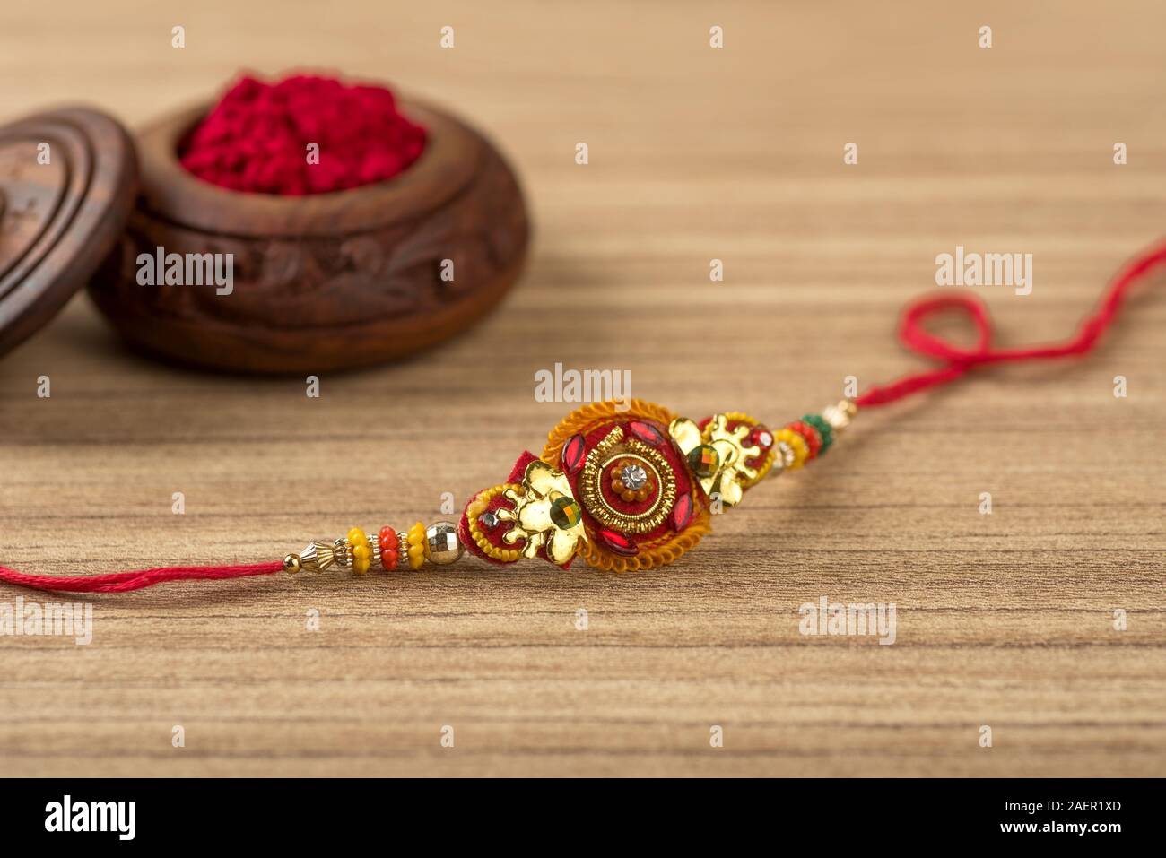 Indian festival: Raksha Bandhan background with an elegant Rakhi, Rice ...