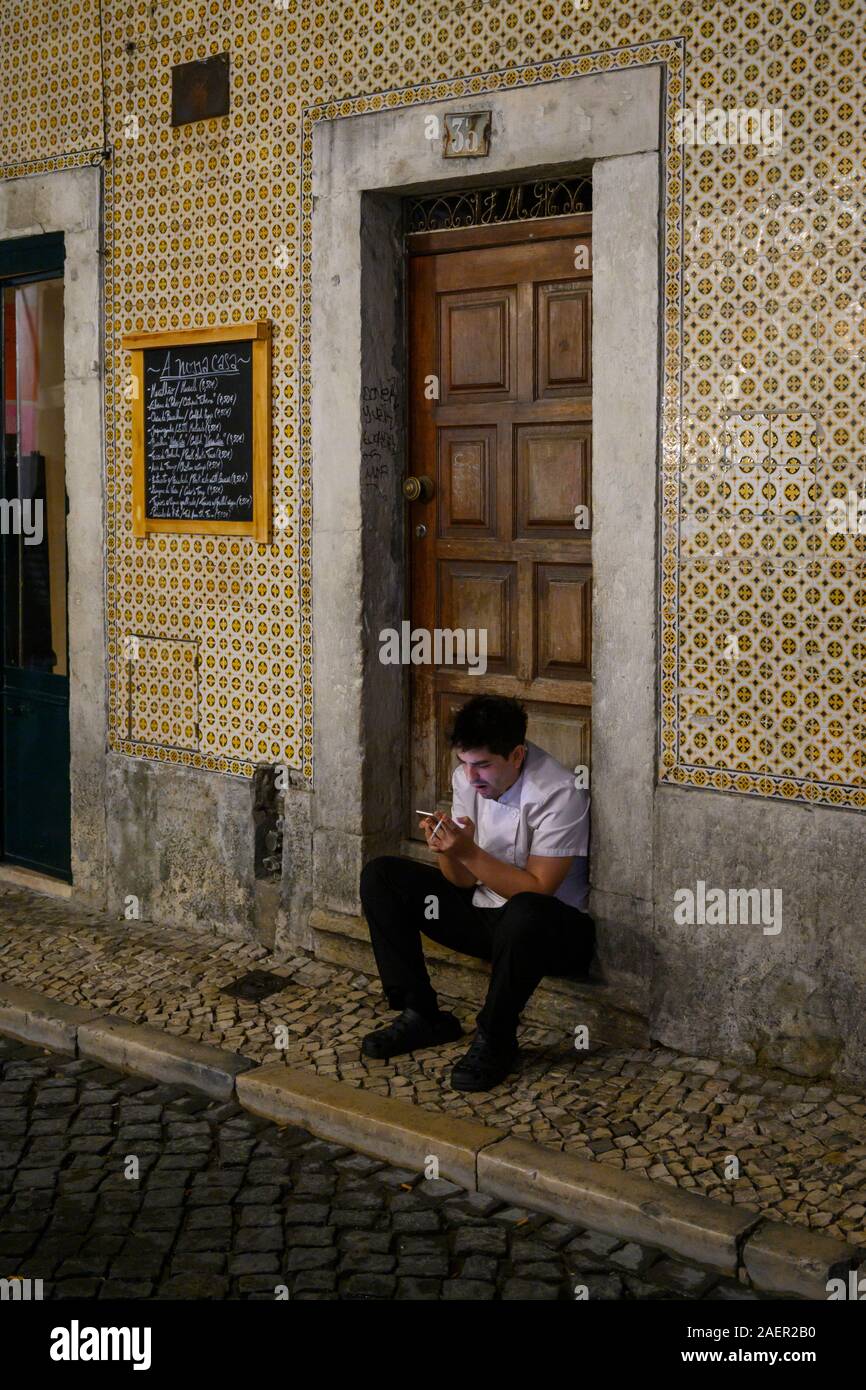 cigarette in wall Man smoking cigarette on wall hi-res stock photography and images
