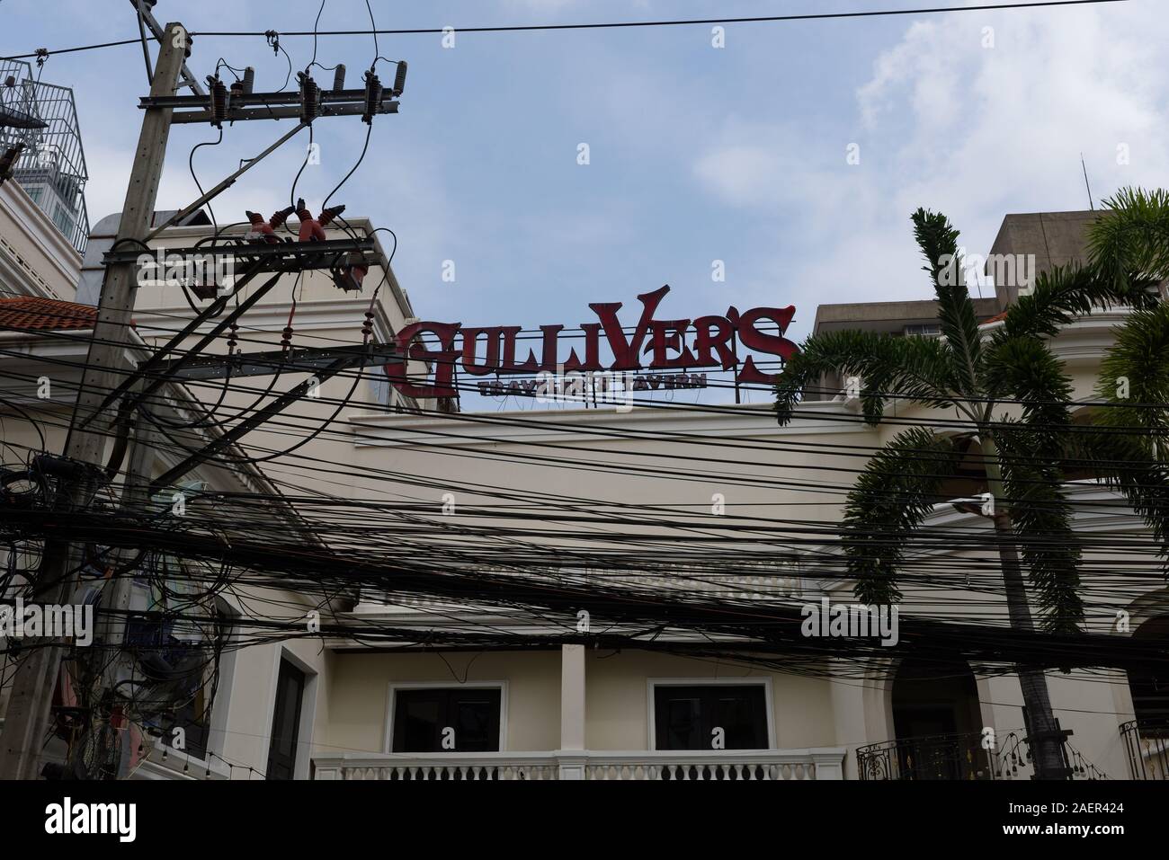No one will ever call the overhead power cables in Bangkok well managed. Stock Photo