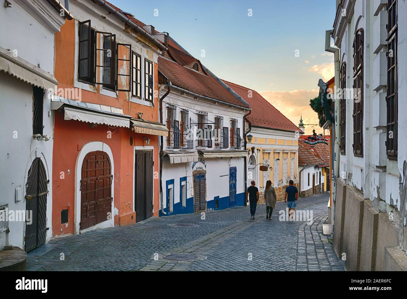 Old street with walking figures in Szentendre, Hungary Stock Photo
