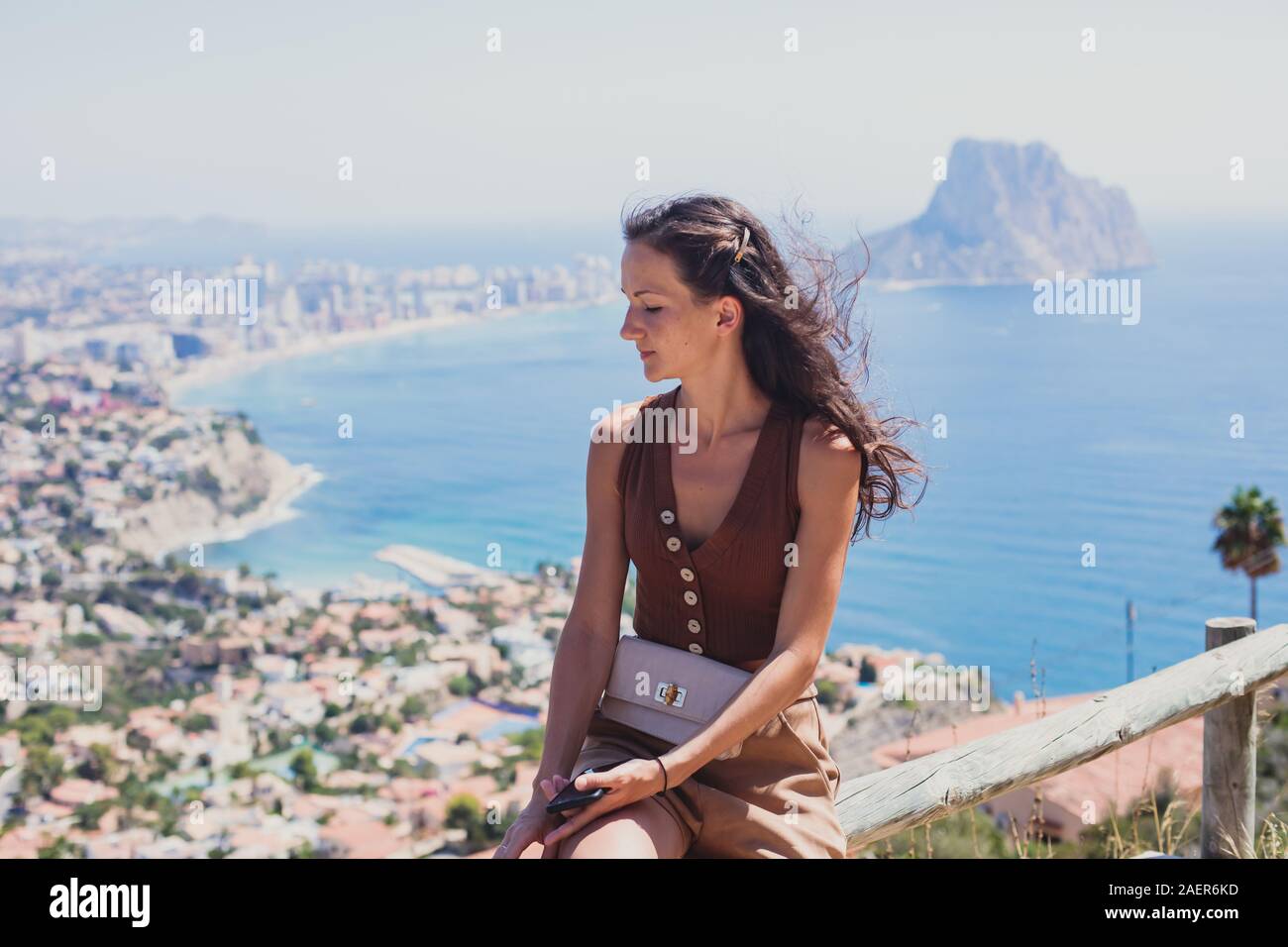 Beautiful super wide-angle aerial view of Calpe, Calp, Spain with harbor and skyline, Penon de Ifach mountain, beach and scenery beyond the city, seen Stock Photo