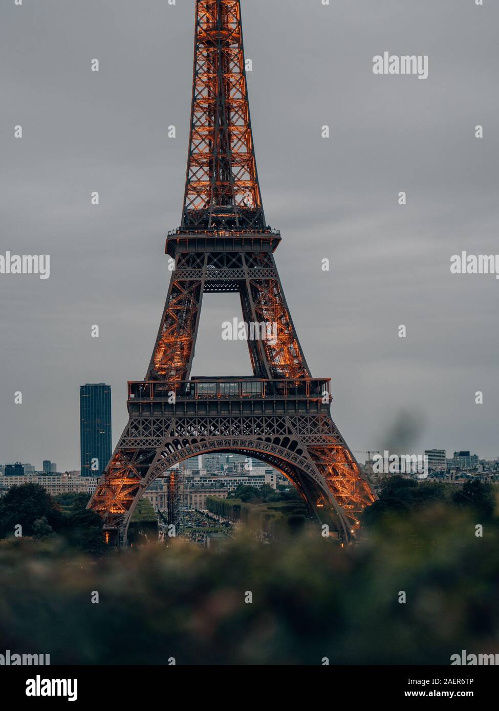 lighted up Eiffel Tower in the evening in Paris, France Stock Photo