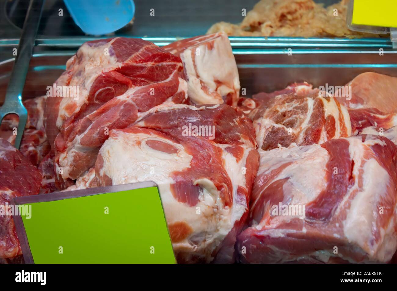 Pieces of raw meat at the grocery market. Pork fillet. High protein foods for cooking meat. Stock Photo