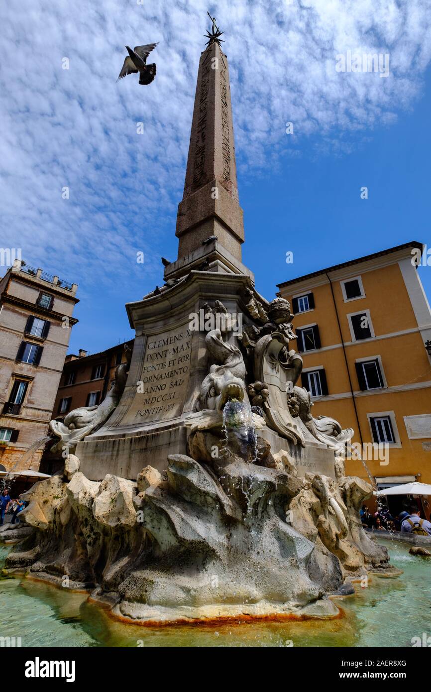 A dove launches itself into the sky from the fountain in the Piazza della Rotonda, Rome, Italy Stock Photo