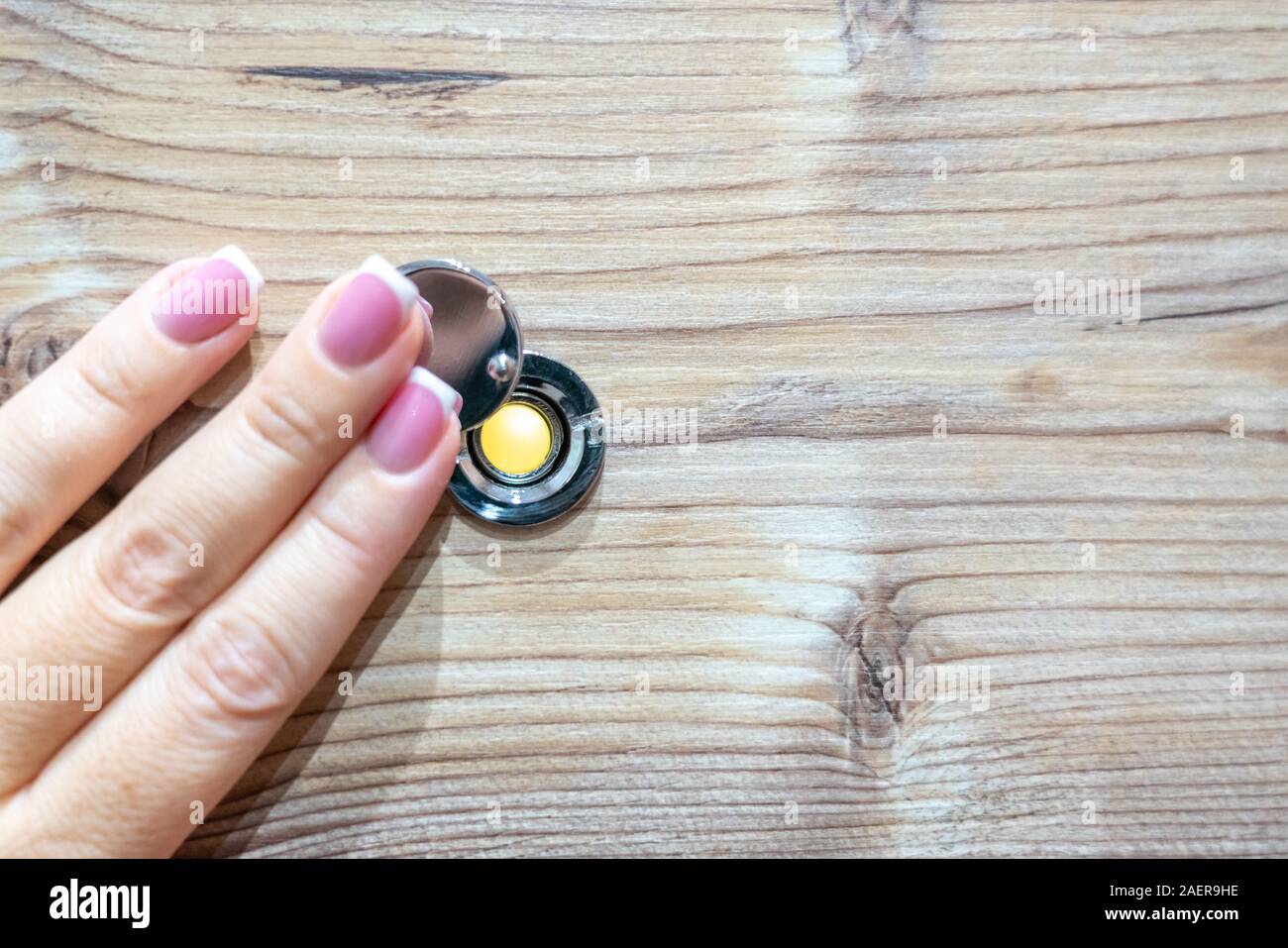 Home Alone Woman Watching On Peephole Door When Somebody Knocking
