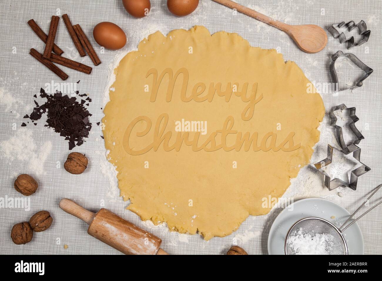 Merry Christmas written on a cookie dough Stock Photo