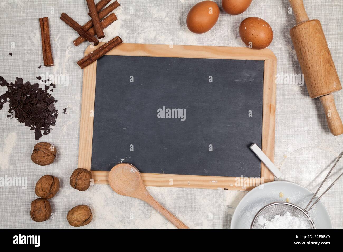 Empty blackboard and cookie baking table Stock Photo