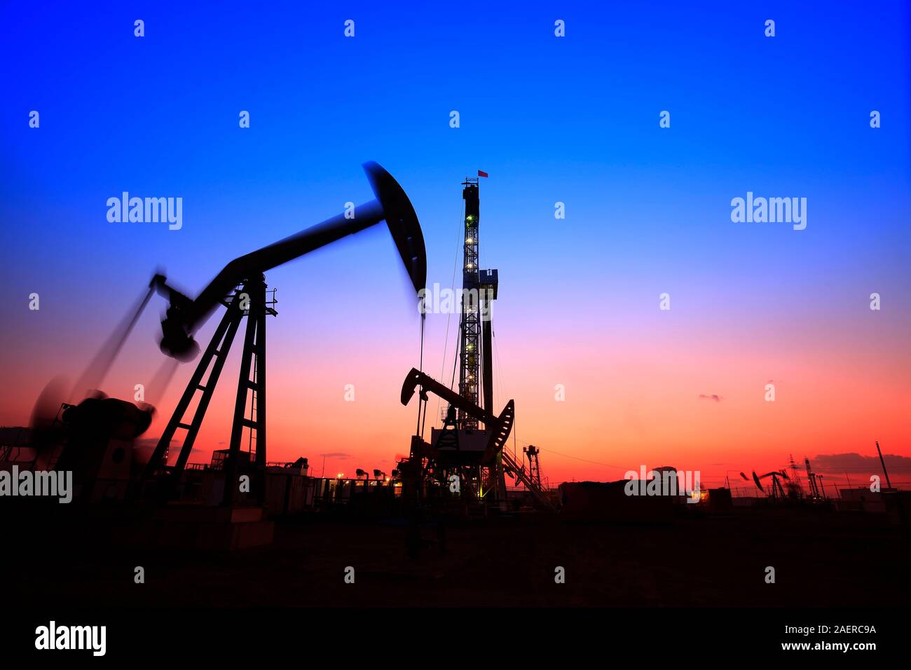 In the evening of oilfield derrick Stock Photo Alamy