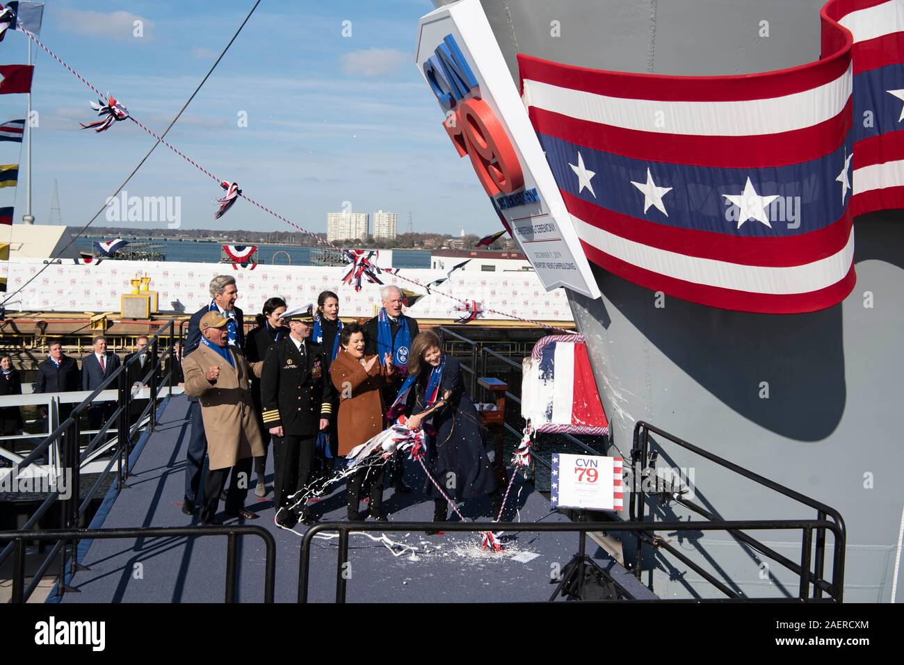 Amb. Caroline Kennedy, right, daughter of the late President John F. Kennedy swings a bottle of champagne to christen the new Ford-class aircraft carrier USS John F. Kennedy at Huntington Ingalls Industries December 7, 2019 in Newport News, Virginia. Kennedy is the second ship in the next-generation Ford-class of nuclear-powered aircraft carriers and the second U.S. aircraft carrier named for President Kennedy, with the former retired from service in 2007. Stock Photo