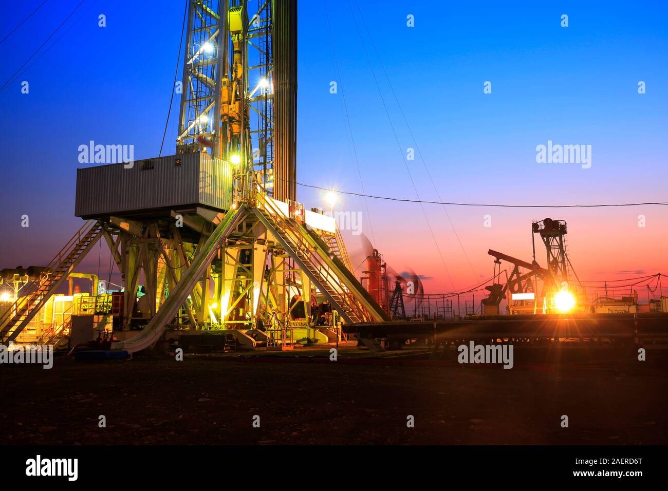In the evening of oilfield derrick Stock Photo Alamy