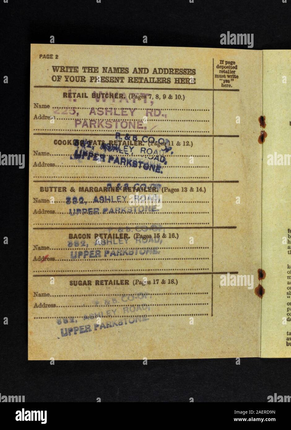 List of retailers inside a replica Ration Book from 1941, a piece of World War II related memorabilia from Britain in the 1940s. Stock Photo