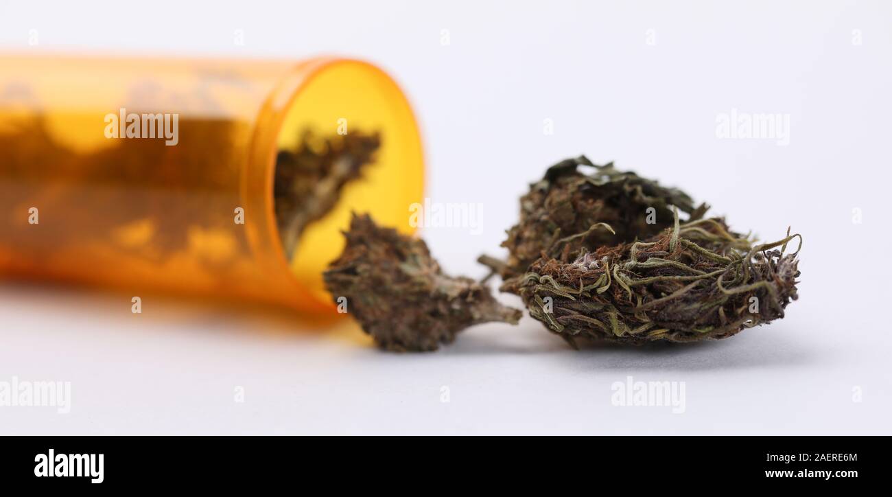 Plastic jar with herb drug Stock Photo Alamy