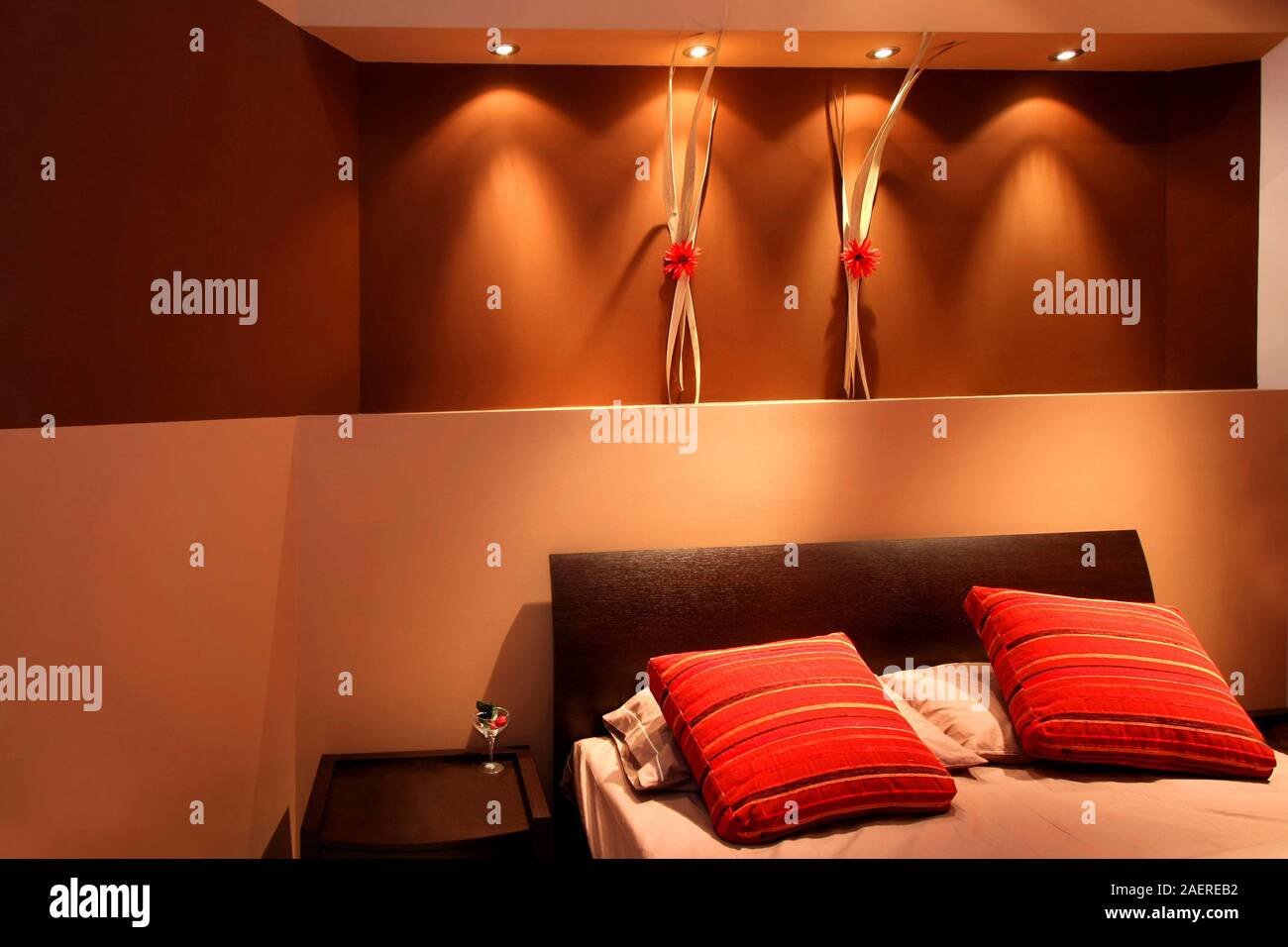 Interior of brown bedroom with modern furniture Stock Photo Alamy