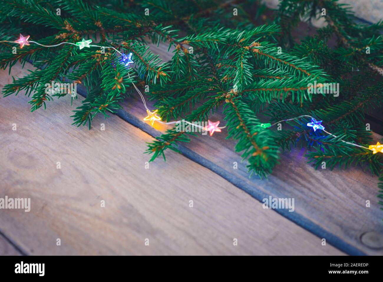 Christmas sparkling Garland with branches of fir tree and cones on the ...